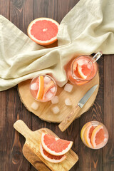 Composition with tasty grapefruit lemonade on wooden background