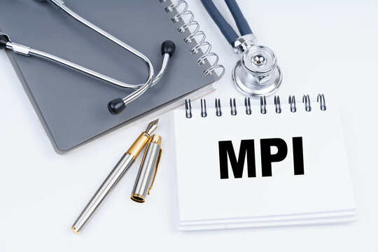 On the table are a stethoscope, a pen and a notebook with the inscription - MPI