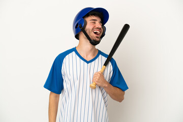 Young caucasian man playing baseball isolated on white background laughing