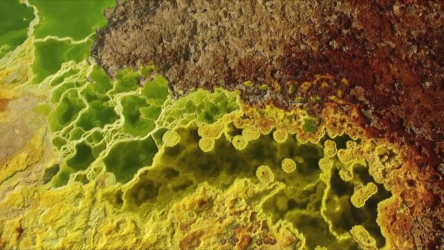 Wonders of planet Earth. Fantastic paints of the Danakil Desert. The Sulphur springs create the unearthly colourful and beautiful landscape. An aerial view. Africa. Ethiopia.