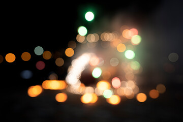 Abstract background from blurry bokeh lights, different colors, orange, yellow. City lights, bright lights