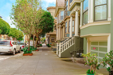 Fototapeta na wymiar Facades of townhouses with famous Victorian architecture, streets. San Francisco, USA - 17 Apr 2021