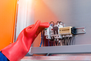 The engineer checks the absence of induced voltage on the high voltage cells