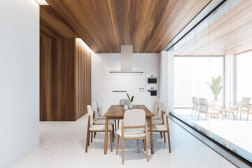 Wooden and white kitchen interior with table and counters