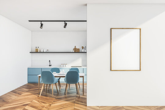 Modern white and blue kitchen interior with poster