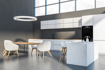 Grey and white kitchen interior with furniture on concrete floor and window
