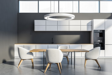 Grey and white kitchen interior with furniture on concrete floor and window