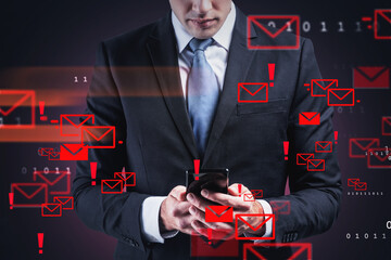 Businessman holding phone in hands, background of blocked mails and binary code