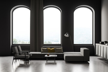 Dark living room interior with armchairs and sofa, drawer and arched windows