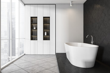 Naklejka na ściany i meble White bathtub in bathroom interior with window, mockup on black tiled wall