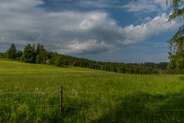 Meadows and fields between Vacov and Ckyne towns in Sumava mountains