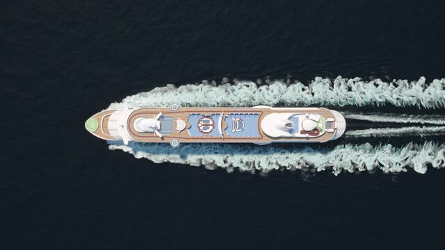 Cruise liner floating in ocean, top view