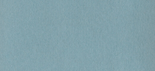 Clean blue cardboard paper background texture. Horizontal banner