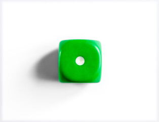 Number 1 on green dice. White background.