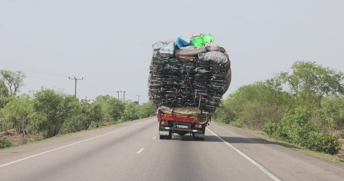 Overloaded truck bicycles northern Ghana Africa. Roads and highways unsafe with vehicles and trucks loaded dangerously. Bikes being taken to the northern Region of Ghana.