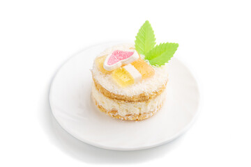 Decorated cake with milk and coconut cream isolated on white background. Side view.