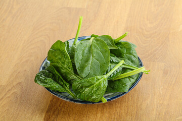Fresh green spinach leaves in the bowl