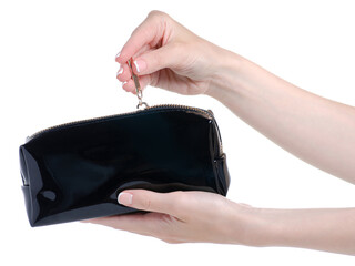 Hand holding opened black cosmetic bag beauty on white background isolation