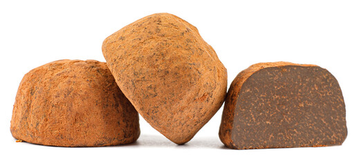 Chocolate truffles are whole and half are isolated on a white background.