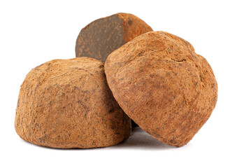 Chocolate truffles are whole and half are isolated on a white background.