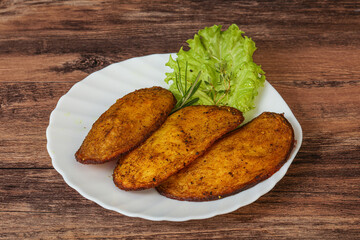 Baked potato with herbs and spices