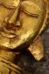 golden sculpture of a buddha head