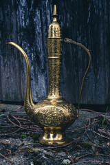 close-up of an antique golden magic lamp