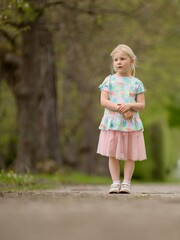 Little girl summer portrait in nature