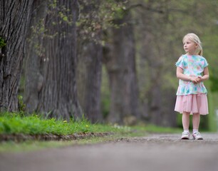 Little girl summer portrait in nature