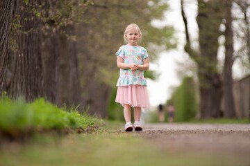 Little girl summer portrait in nature