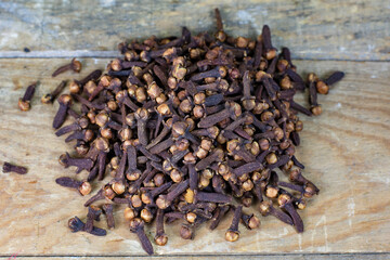 clove grains on wooden table