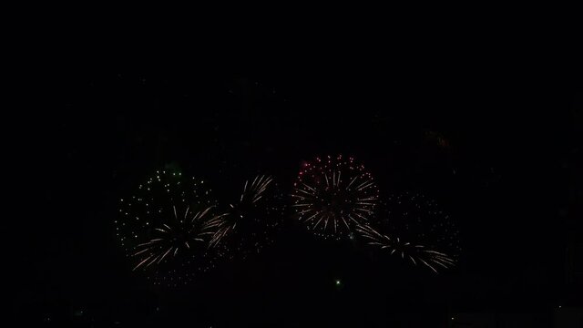 Festival real fireworks display in black sky with multicolor and different pattern or style. Celebration and holiday show for people enjoy and happy concept.