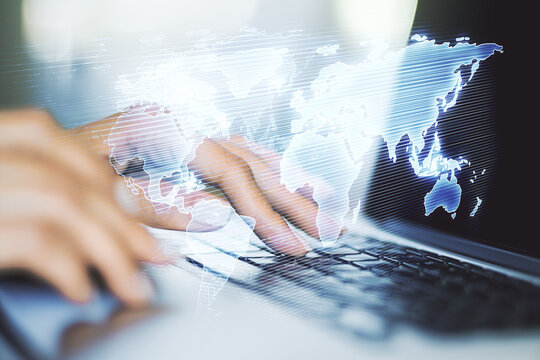 Double exposure of abstract digital world map and hand typing on laptop on background, research and strategy concept - Powered by Adobe