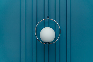 lamp in the form of a ball against the background of the wall