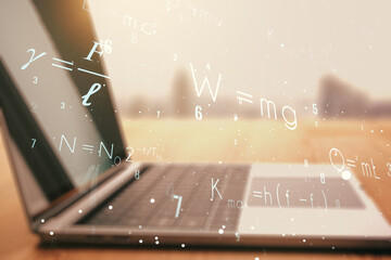 Creative scientific formula hologram on modern laptop background, research concept. Multiexposure