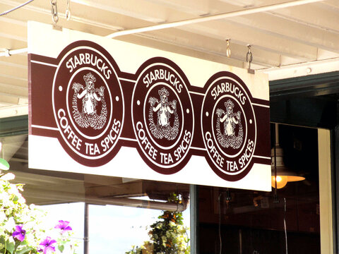 Seattle, Washington State, USA - August 2012: Sign hanging outside the original branch of the Starbucks coffee chain.
