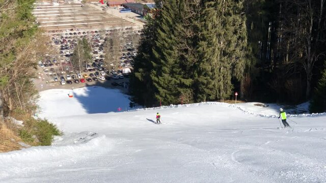Austrian ski resort on sunny winterday with skiers