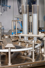 Fragment of a food processing line for filling and packaging liquid products.