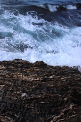 white foam on sea coast 