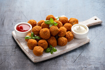 Meat free vegetarian mini picnic scotch eggs with micoprotein and herbs served with ketchup and mayonnaise