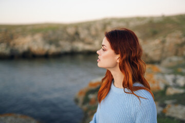 woman in blue sweater outdoors fresh air rocky mountains landscape recreation