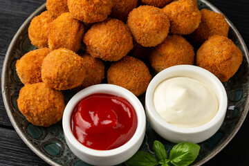 Meat free vegetarian mini picnic scotch eggs with micoprotein and herbs served with ketchup and mayonnaise