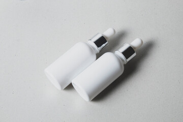 mockup of beauty fashion cosmetic makeup bottle lotion  serum dropper product with skincare healthcare concept on background