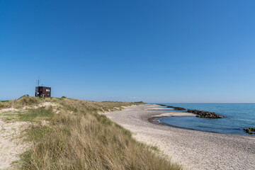 Fototapeta na wymiar Danish military radar and coast guard station at the beaches of Skagen in northern Denmark