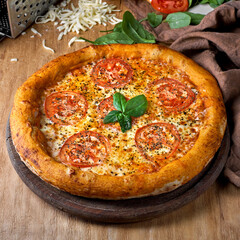 Pizza Margherita on a wooden background, photo for the menu, traditional food.