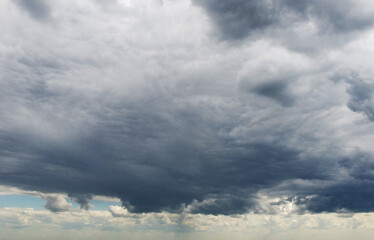 Beautiful contrasting large clouds in blue sky for background