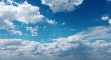 Beautiful contrasting large clouds in blue sky for background