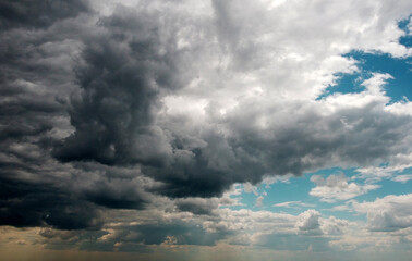 Beautiful contrasting large clouds in blue sky for background