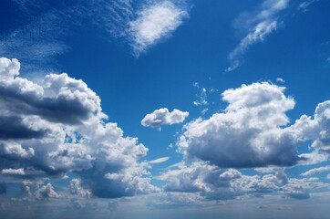 Beautiful contrasting large clouds in blue sky for background