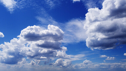 Beautiful contrasting large clouds in blue sky for background